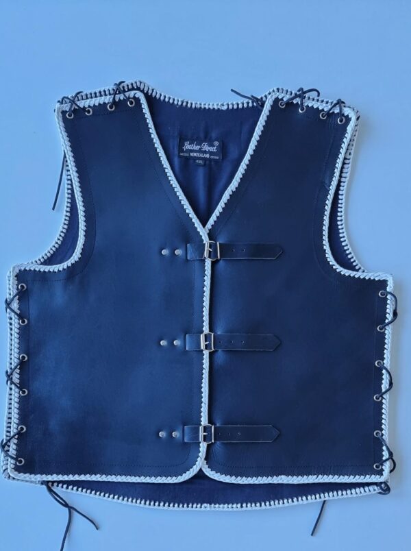 Black leather vest with white braids